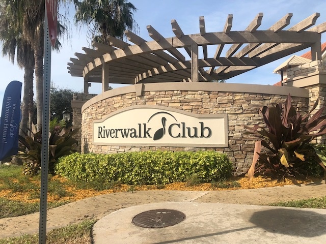 Riverwalk Club Sign